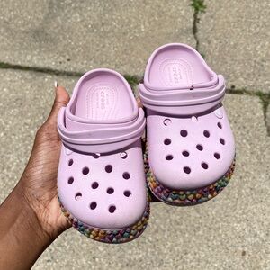 Toddler girls pink crocs with rainbow bottom